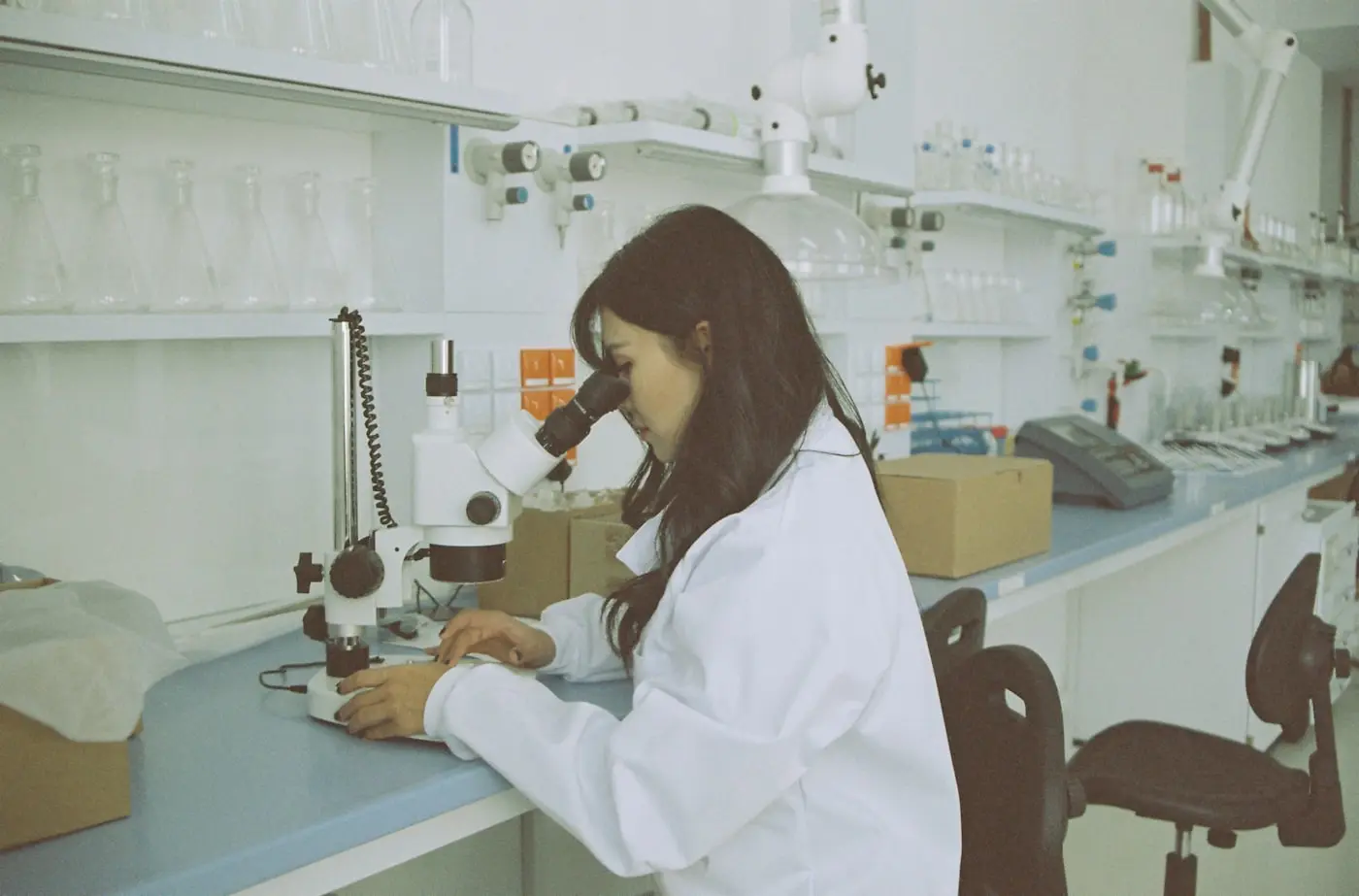 Laboratory technician operating advanced analytical equipment